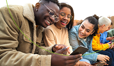 Group of friends using a mobile phone